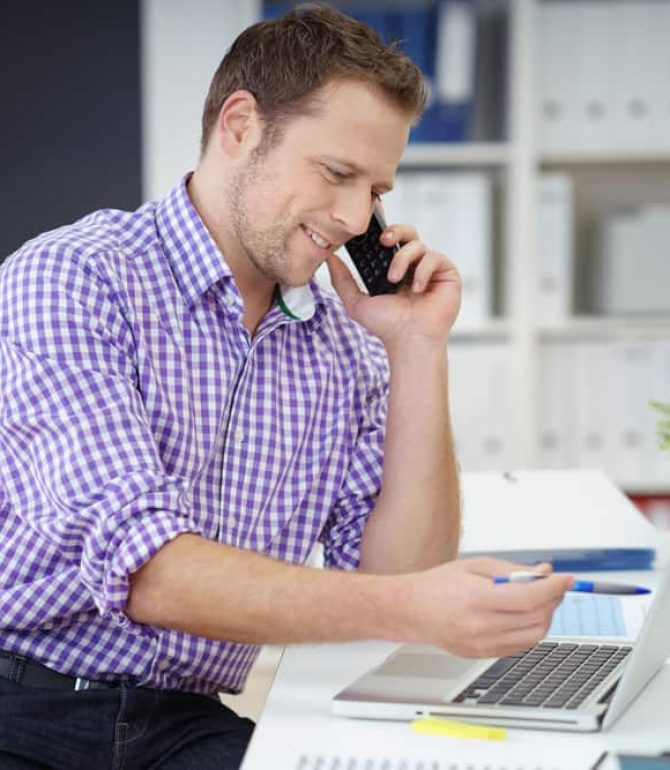 Guy calling on his cellphone — Your Trusted Accountant on the Central Coast, NSW