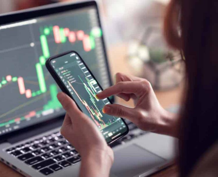 Woman Analysing Crypto Chart On Phone